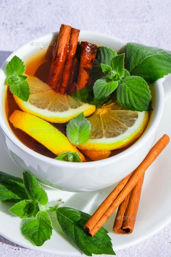 Black and green tea with lemon, cinnamon sticks and mint leaves. Hot