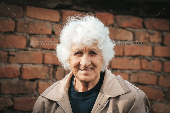 Beautiful grandma is smiling at the camera