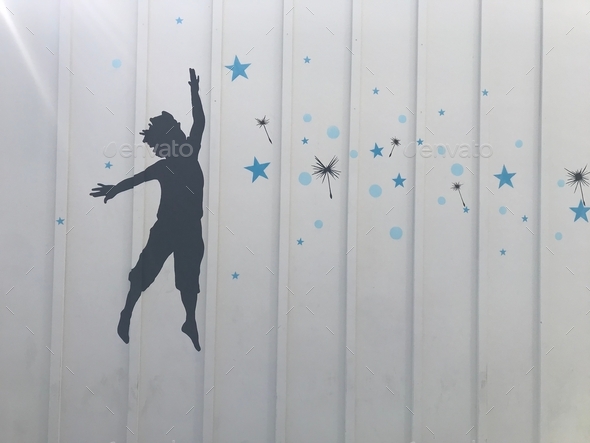 A magical enchanting mural of a child reaching for the stars