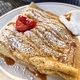 Duice De Leche Caramel, powdered sugar with chantilly cream sweet crepe on plate with strawberry. - PhotoDune Item for Sale