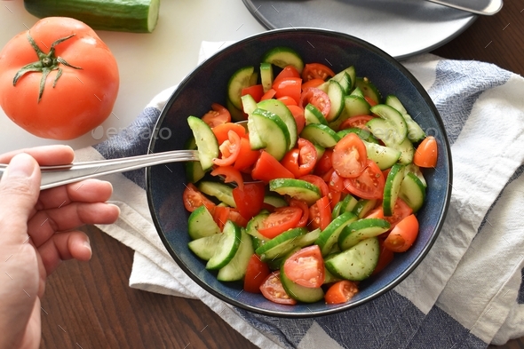 Cucumber and tomato salad. Healthy and dietary food. Weight loss program meal.