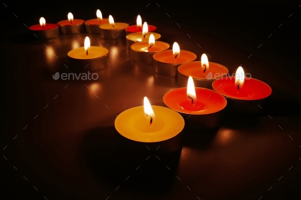 Tealight candles in the dark. Concept of meditation and peaceful life.