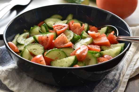 Cucumber and tomato salad. Healthy and dietary food. Weight loss program meal.