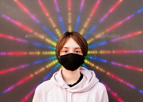 Face mask on a tween in front of a digital starburst