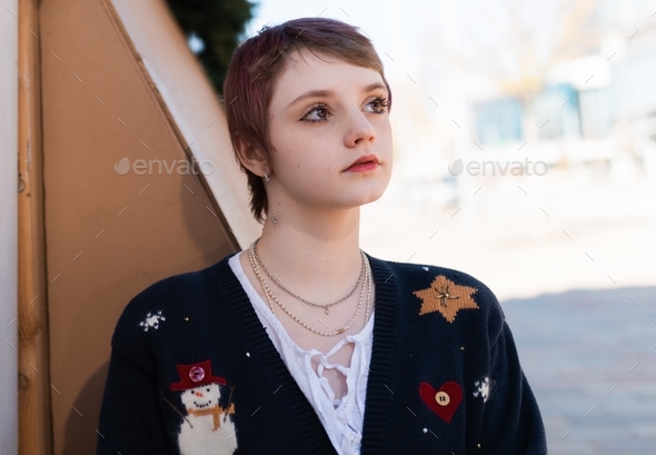 Young teen outdoor Christmas portrait - ugly sweater
