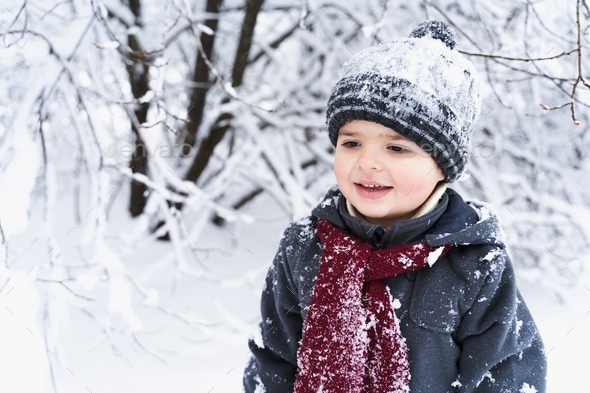 Little stylish smiling happy cute boy. Kid walking in beautiful winter ...