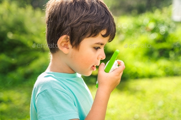 Small boy,kid,child play in walkie-talkie.Walkie Talkies with channels ...