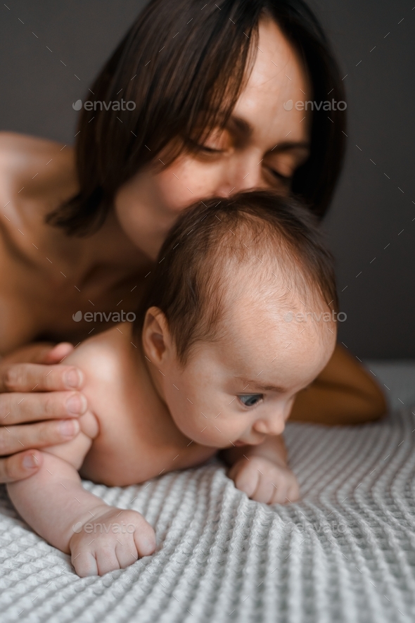 Mom, mummy, young mother with little baby daughter. Breast-feeding