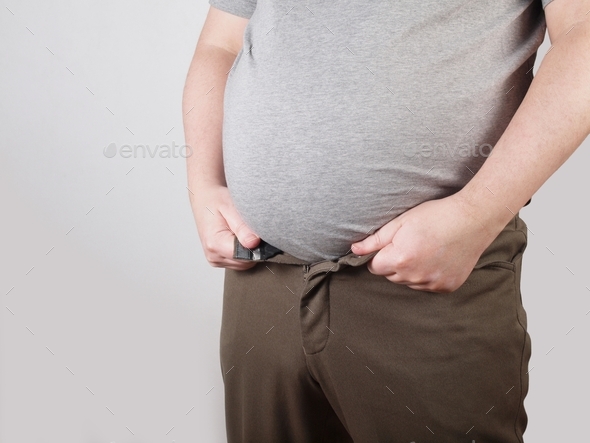 obese man with fat belly doesn´t fit in his trousers anymore