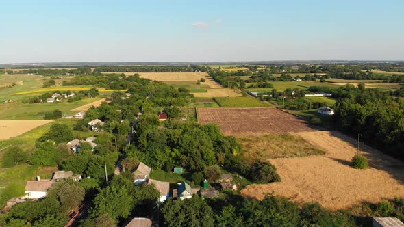  Aerial View of the Countryside and Small Village with Green Fields and Meadows alt