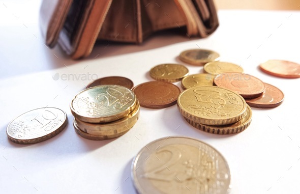 Euro cents on the white table  - Stock Photo - Images