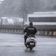 Man riding a two wheeler in heavy rains - PhotoDune Item for Sale
