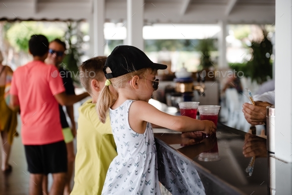 Kids ordering juice at the open air bar.
