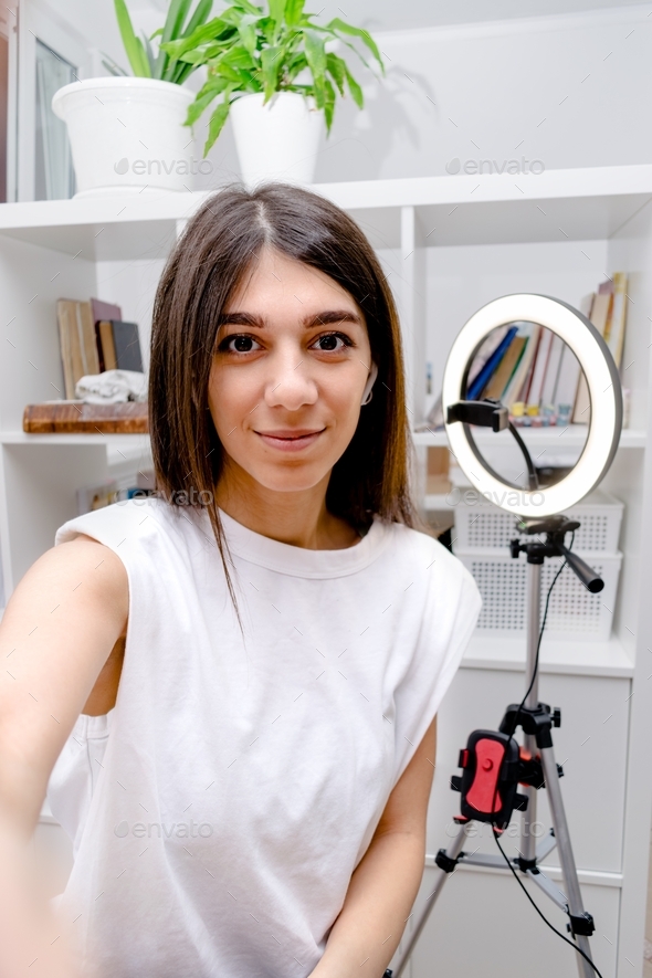 Girl blogger taking picture of herself, selfie,preparing for a live ...
