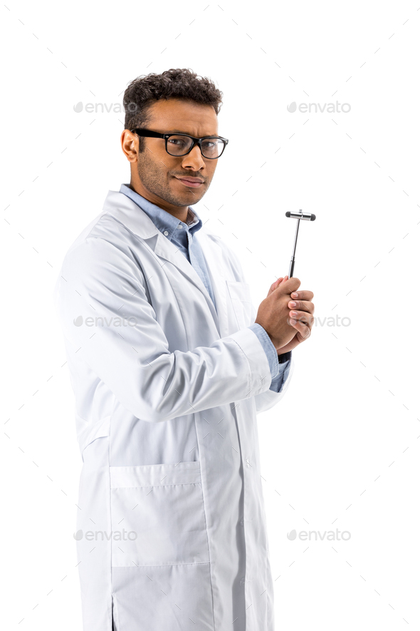 Young professional doctor in eyeglasses holding reflex hammer isolated on white