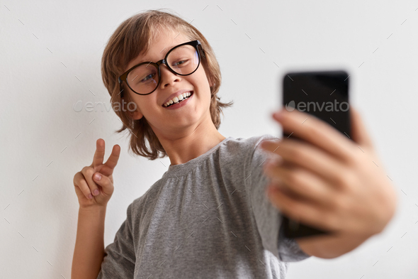Happy youngster taking selfie