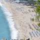 top view of a huge beach where people sunbathe - PhotoDune Item for Sale