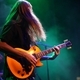 man with long hair playing guitar in a band - PhotoDune Item for Sale