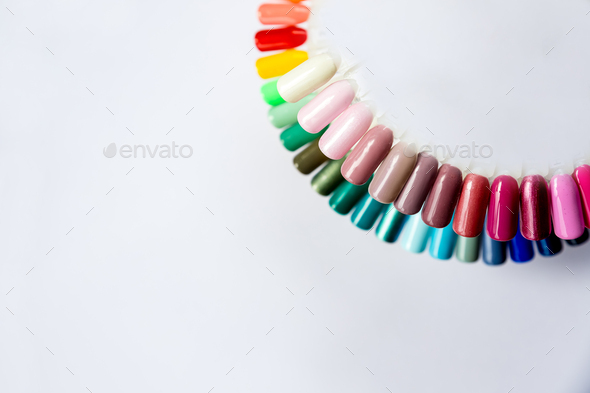 Nail polish samples in different bright colors. Colorful nail lacquer manicure swatches.nail art