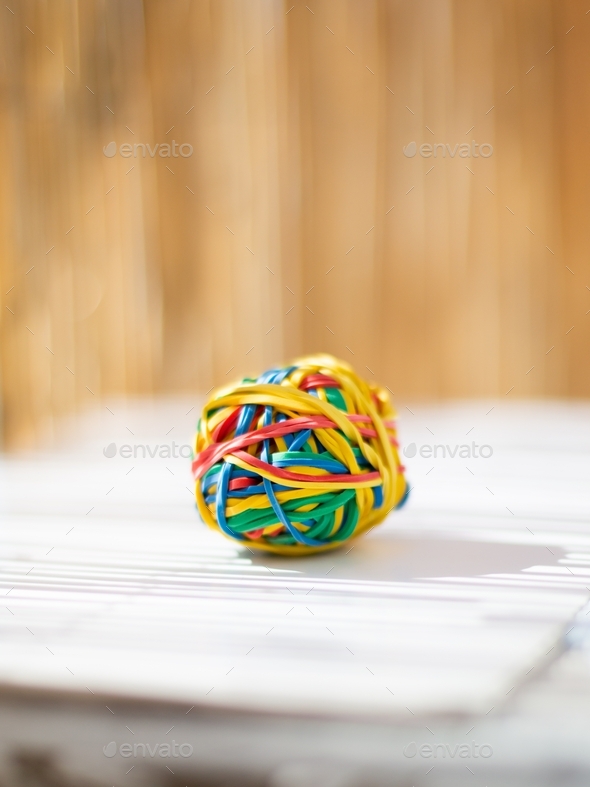 Colorful rubber band ball in shallow depth of field