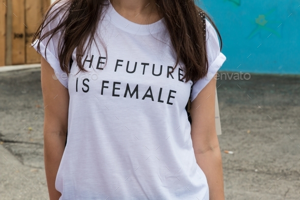 A woman wearing a shirt that says the future is female