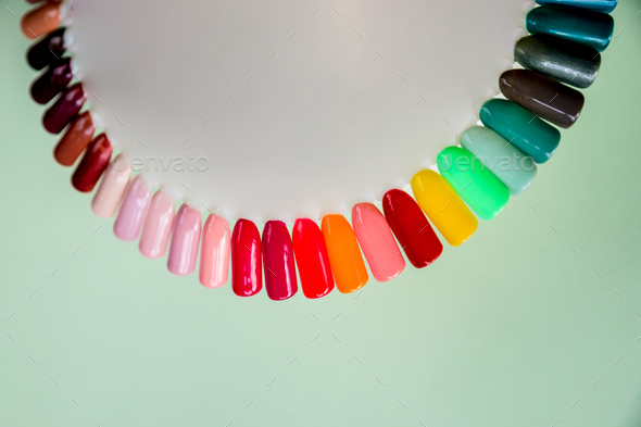 Nail polish samples in different bright colors. Colorful nail lacquer manicure swatches. nail art