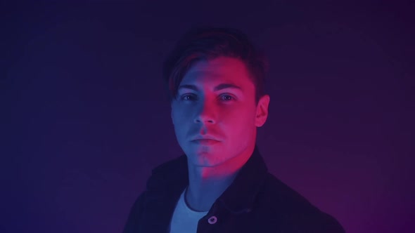 Portrait of the Profile of the Young Handsome Young Caucasian Male Dressed in Black Shirt Turning alt