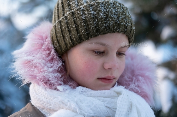 Porter of a young girl walking on a winter day. - Stock Photo - Images