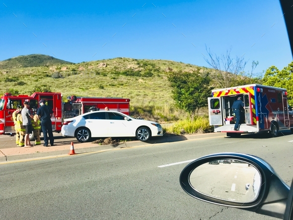 Traffic jam as first responders help a motorist who was injured in a car accident