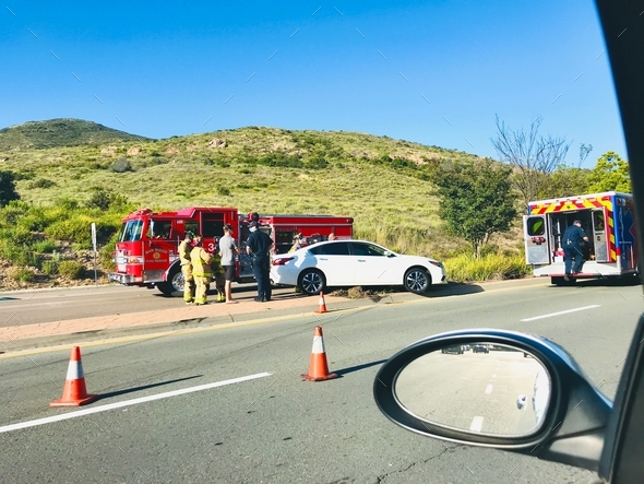Traffic jam as first responders help a motorist who was injured in a car accident