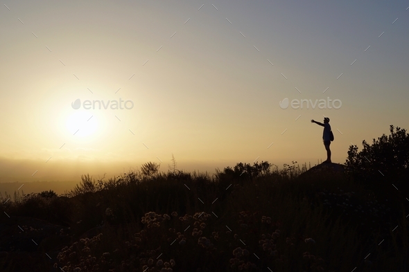 Open hand to the sun on the top of the mountain, doing yoga and refreshing the mind