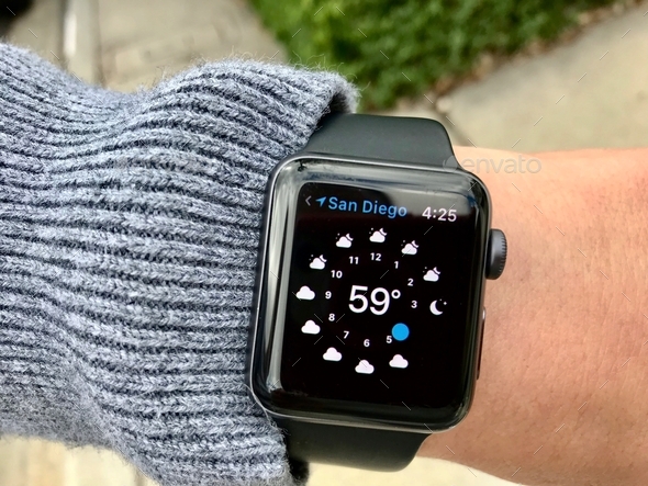 Checking the weather forcast on an Apple Watch. tonythetigersson, Tony Andrews Photography - Stock Photo - Images