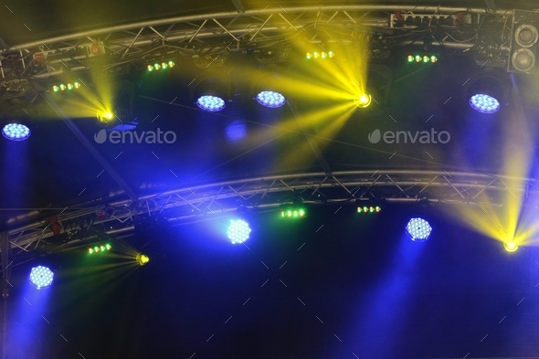 stage lights on a concert open air during night time. colorful. - Stock Photo - Images