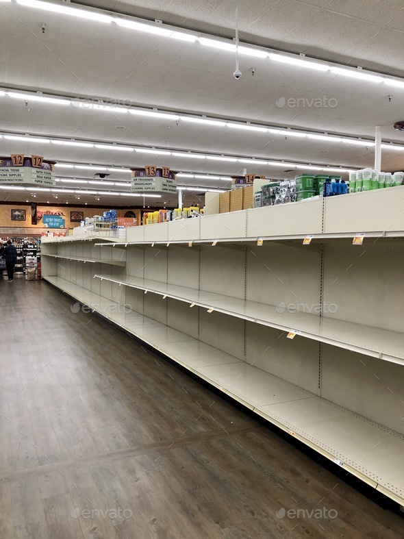 Empty toilet paper shelves at the market grocery store at the beginning of the 2020 pandemic
