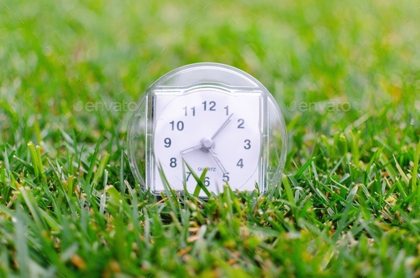 Time, clock in the grass, daylight saving time, spring forward
