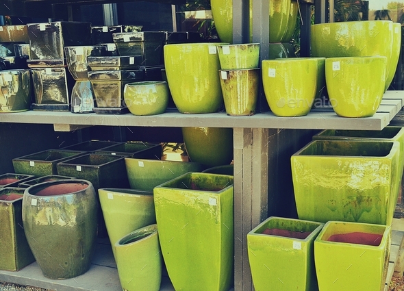 Color gradient, green ceramic planter pots on a shelf at the home and garden retail store