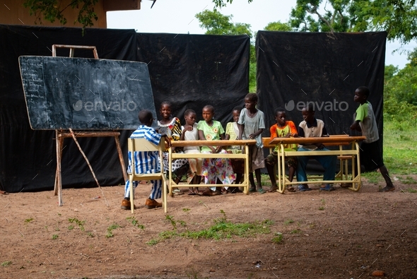 African schoolkids following a language lesson outside - schoolboard teach student travel africa