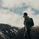 Young backpacker man looking at snow mountain horizon  - PhotoDune Item for Sale