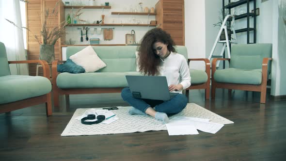 Female Worker Types on Laptop During Quarantine, Covid-19 Lockdown. Remote Work Concept. alt