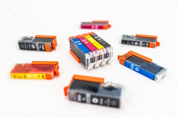 Close-up shot of a CMYK ink cartridges for a color printer isolated on a white background. printer