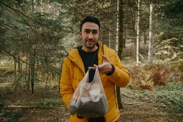Picking up trash in the forest