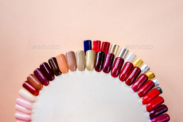 Nail polish samples in different bright colors. Colorful nail lacquer manicure swatches. nail art