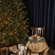 a lot of Christmas gifts laying near decorated Christmas tree. cosy home atmosphere. - PhotoDune Item for Sale