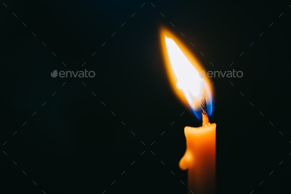 Burning candle isolated on black background. Concept for mourning sadness and sorrow  - Stock Photo - Images