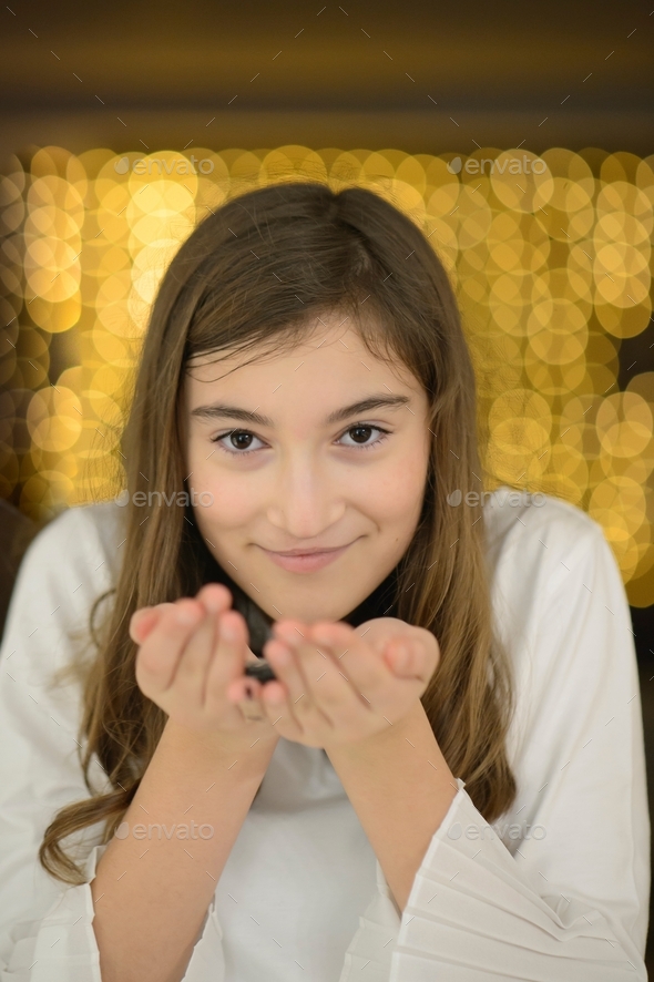 young-girl-ready-to-blow-sparkles-in-the-air-stock-photo-by-stetphotos