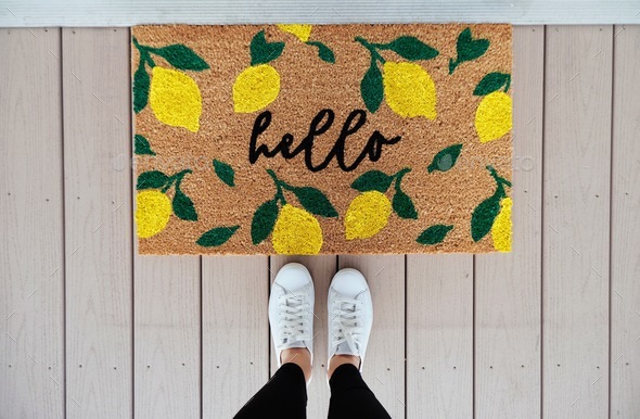 Looking down at welcome mat  - Stock Photo - Images