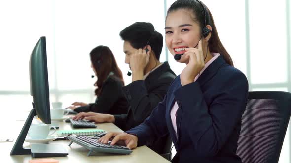 Business People Wearing Headset Working in Office alt