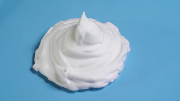 White Shaving Foam On A Blue Background