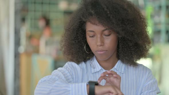 Portrait of African Businesswoman Using Smartwatch alt