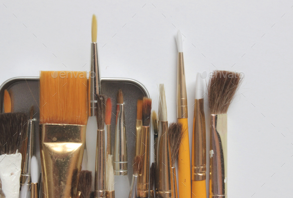 Large group of artist paint brushes on white background
